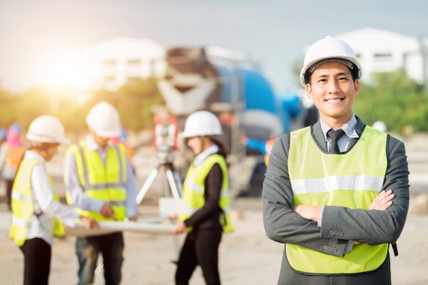 Asian Young businessman view on construction site.